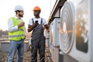 two men discussing HVAC system
